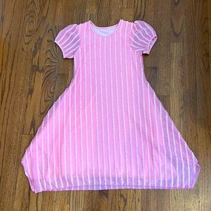 Girls size 7/8 pink dress with vertical ruffles.